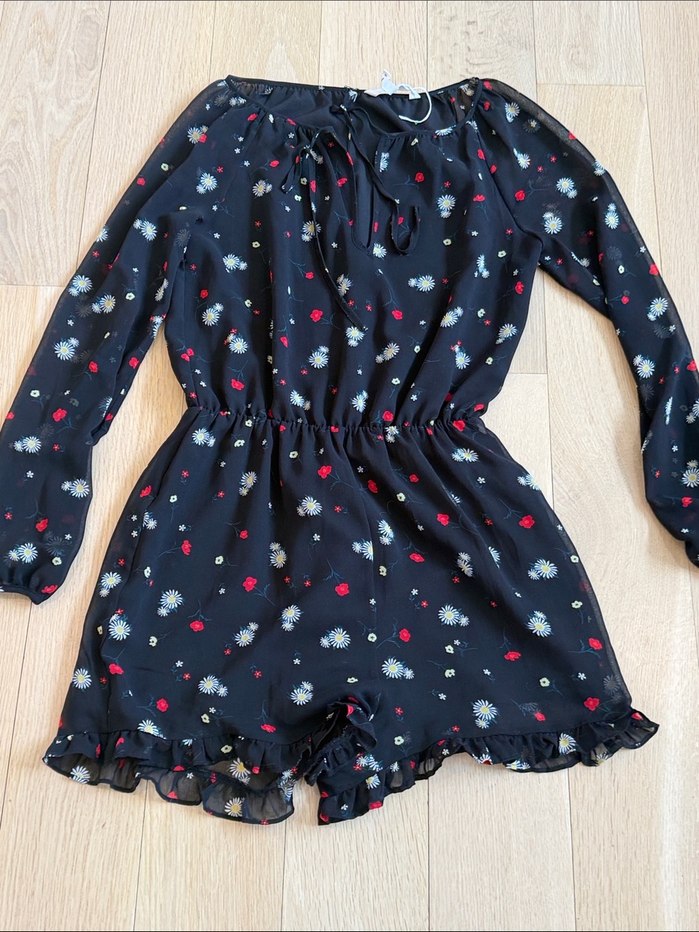BCBGeneration Black Floral Long-Sleeve Romper with Tie Neck